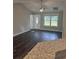 Bright living room featuring hardwood floors and a view of the kitchen at Tbd10 Casey Dr., Green Sea, SC 29545