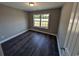 Simple bedroom with dark gray flooring and a window at Tbd11 Casey Dr., Green Sea, SC 29545