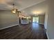 Spacious living room featuring dark laminate floors and a kitchen island at Tbd11 Casey Dr., Green Sea, SC 29545