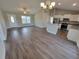 Open concept living room and kitchen with hardwood floors and stainless steel appliances at Tbd9 Casey Dr., Green Sea, SC 29545