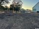 The backyard overlooks a serene pond and distant houses, offering a glimpse of the surrounding community at 1004 James Island Ave., North Myrtle Beach, SC 29582