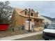A house under construction featuring a framed structure, dormer windows, and a partially completed front porch at 1004 James Island Ave., North Myrtle Beach, SC 29582