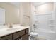Modern bathroom boasts a sleek vanity with quartz countertops and a shower-tub combo at 1099 Nw Forest Bend Dr., Calabash, NC 28467