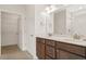 Bathroom featuring double sink vanity with modern fixtures and walk-in closet at 1099 Nw Forest Bend Dr., Calabash, NC 28467