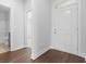 Bright entryway features hardwood floors, neutral walls, and a view of the bathroom through an open doorway at 1099 Nw Forest Bend Dr., Calabash, NC 28467
