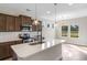 Stylish kitchen with quartz countertops, stainless steel appliances, and a central island at 1099 Nw Forest Bend Dr., Calabash, NC 28467