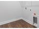 Practical laundry room showcases durable hardwood flooring and essential hookups at 1099 Nw Forest Bend Dr., Calabash, NC 28467