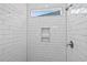 Tiled shower with niche, rainfall shower head, and window at 1099 Nw Forest Bend Dr., Calabash, NC 28467
