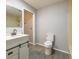 Updated bathroom with white vanity and gray tile floor at 117 George Washington Trail, Georgetown, SC 29440