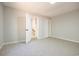 Simple bedroom with gray walls, carpet, and a closet at 117 George Washington Trail, Georgetown, SC 29440