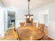 Charming dining room with wood table and chair set, kitchen view at 117 George Washington Trail, Georgetown, SC 29440