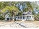 House exterior, showcasing a front porch and driveway at 117 George Washington Trail, Georgetown, SC 29440
