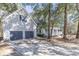 Two-story house with a two-car garage and wraparound porch at 117 George Washington Trail, Georgetown, SC 29440
