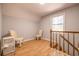Small loft area with two chairs and a view of the stairs at 117 George Washington Trail, Georgetown, SC 29440