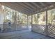 Screened porch with wooden deck overlooking backyard at 117 George Washington Trail, Georgetown, SC 29440