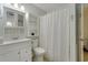 Simple bathroom featuring a white vanity, toilet and shower/tub at 123 Dogwood Dr. N # 106A, Garden City Beach, SC 29576