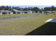 Community backyard view with a pond surrounded by newly constructed homes at 1336 Winding Creek Way, Myrtle Beach, SC 29588