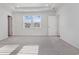 A bright bedroom with neutral walls and carpet and a large window at 1336 Winding Creek Way, Myrtle Beach, SC 29588