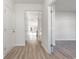Inviting hallway featuring wood-look flooring and neutral paint, connecting various rooms of the home at 1336 Winding Creek Way, Myrtle Beach, SC 29588