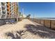 Beachfront boardwalk path with loungers and ocean views at 1501 S Ocean Blvd. # 623, Myrtle Beach, SC 29577