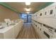 Clean and spacious laundry room with several washers and dryers at 1501 S Ocean Blvd. # 623, Myrtle Beach, SC 29577