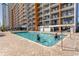 Refreshing outdoor pool with brick patio and surrounding building at 1501 S Ocean Blvd. # 623, Myrtle Beach, SC 29577