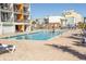 Outdoor pool with surrounding lounge chairs at 1501 S Ocean Blvd. # 623, Myrtle Beach, SC 29577