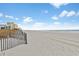 Expansive sandy beach with ocean view and wooden fence at 1501 S Ocean Blvd. # 846, Myrtle Beach, SC 29577