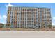 Tall building with balconies, situated directly on the beach at 1501 S Ocean Blvd. # 846, Myrtle Beach, SC 29577