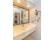 Bathroom vanity with large mirror, adjacent to the kitchen area, hair dryer and towel rack at 1501 S Ocean Blvd. S # 1450, Myrtle Beach, SC 29577