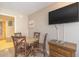 Cozy dining area complete with dining table, four chairs and a flat screen TV at 1501 S Ocean Blvd. S # 1450, Myrtle Beach, SC 29577