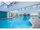 Bright indoor pool area with a fountain feature, open ceilings, and views of the surrounding complex at 1501 S Ocean Blvd. S # 1450, Myrtle Beach, SC 29577