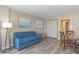 Cozy living room with comfortable blue sofa, stylish wood flooring, and elegant wall art at 1501 S Ocean Blvd. S # 1450, Myrtle Beach, SC 29577