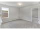 Bedroom with soft carpeting, natural lighting, and a doorway leading to another room at 1508 Clubstone Dr., Conway, SC 29526
