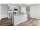 Modern kitchen features gray cabinets, granite countertops, stainless steel appliances, and a stylish island at 1508 Clubstone Dr., Conway, SC 29526