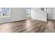 Bright living room with hardwood floors, staircase, and natural light from two windows overlooking the outdoors at 1508 Clubstone Dr., Conway, SC 29526