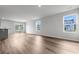 Spacious living room with wood floors, large windows, and sliding glass doors to the outdoors at 1508 Clubstone Dr., Conway, SC 29526