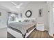 Spacious bedroom with a king-size bed and modern nightstand at 1870 Auburn Ln. # 21J, Surfside Beach, SC 29575