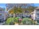 Building exterior with landscaping and American flags at 1870 Auburn Ln. # 21J, Surfside Beach, SC 29575