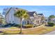 Side view of the building showcasing its architectural style and landscaping at 1870 Auburn Ln. # 21J, Surfside Beach, SC 29575