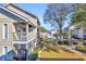Exterior view of the building and surrounding landscape, including a pool at 1870 Auburn Ln. # 21J, Surfside Beach, SC 29575