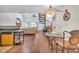 Open kitchen with breakfast bar, wood flooring, and spiral staircase at 1870 Auburn Ln. # 21J, Surfside Beach, SC 29575