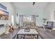 Relaxing living room featuring a sofa and access to a balcony at 1870 Auburn Ln. # 21J, Surfside Beach, SC 29575