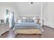 Spacious main bedroom with a king-size bed and high ceilings at 1870 Auburn Ln. # 21J, Surfside Beach, SC 29575
