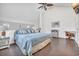 Bright main bedroom with a king-size bed and high ceilings at 1870 Auburn Ln. # 21J, Surfside Beach, SC 29575