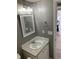Updated bathroom featuring a modern vanity with a framed mirror and sleek lighting at 206 W Pine St., Johnsonville, SC 29555
