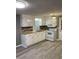 This charming kitchen features a white oven, microwave, and vinyl flooring at 206 W Pine St., Johnsonville, SC 29555