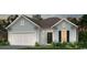 Two-car garage, light blue siding, landscaping at 2518 Watershed Way, Longs, SC 29568