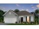 One-story house with gray siding, white garage doors, and landscaping at 2604 Watershed Way, Longs, SC 29568