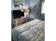 Comfortable bedroom featuring soft lighting, dresser, flatscreen television and soothing decor at 2701 S. Ocean B S Ocean Blvd. # 508, North Myrtle Beach, SC 29582